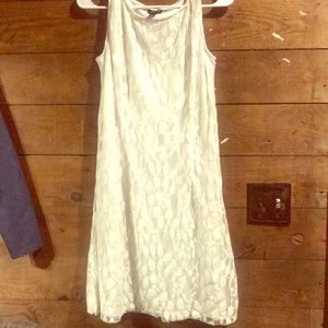 White sleeveless dress.